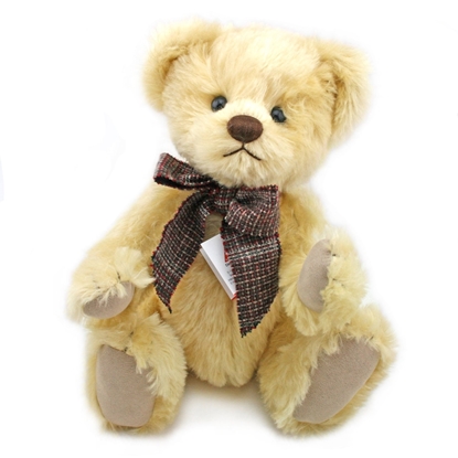 Lichtgele mohair Clemens Teddy Beer van 36 cm met een grote bruin geruite strik.